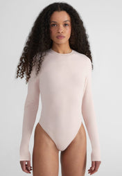 Woman wearing Fitted Longsleeve Bodysuit - baby pink